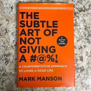 The Subtle Art of Not Giving A #@%! by Mark Manson hardcover book.
